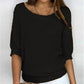 Solid color sweater with a round neckline and 3/4 sleeves