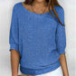 Solid color sweater with a round neckline and 3/4 sleeves