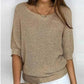 Solid color sweater with a round neckline and 3/4 sleeves