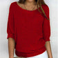 Solid color sweater with a round neckline and 3/4 sleeves